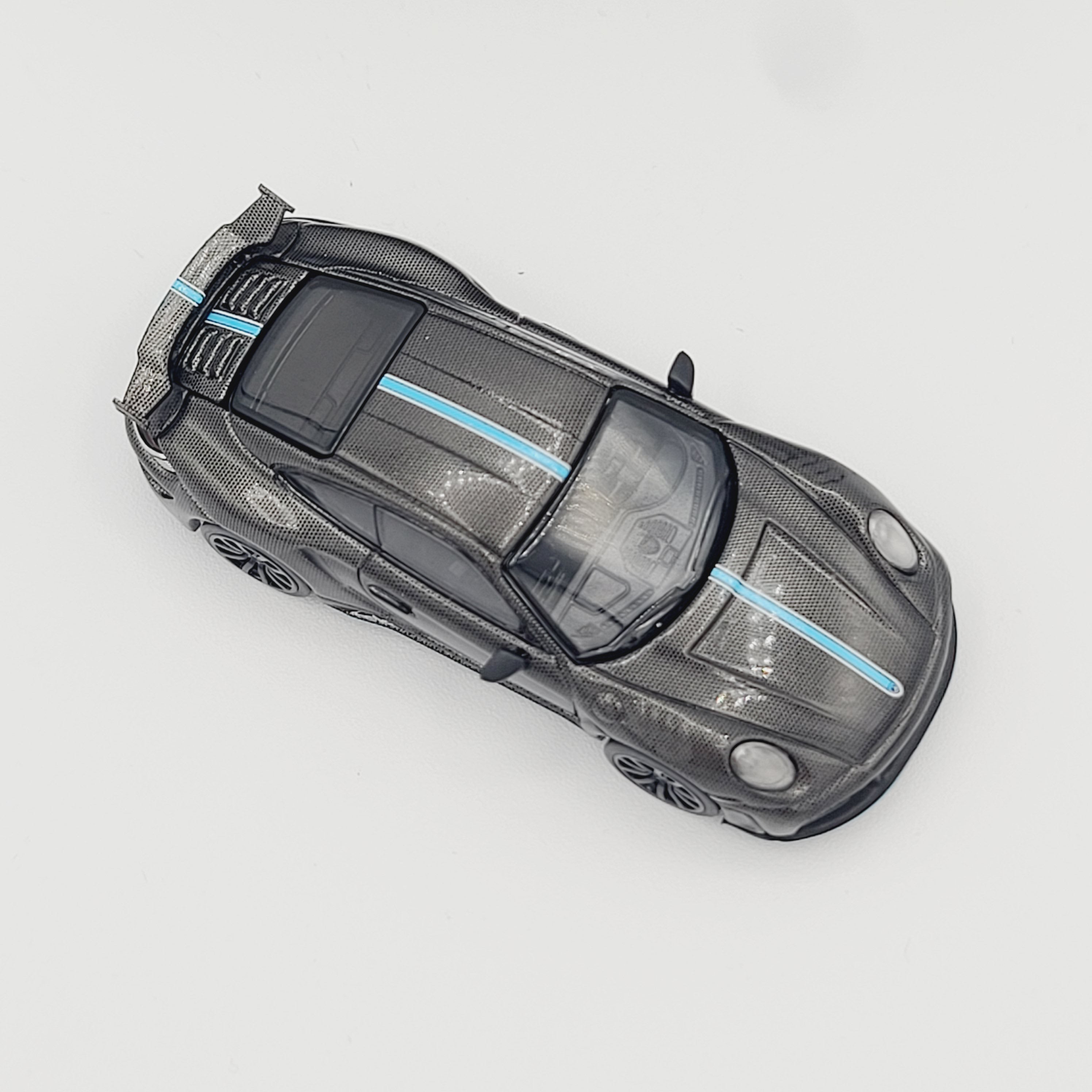 Pop Race Porsche 992 Stinger GTR - 1:64, Carbon Fiber, Blue Stripe (2025 Limited Edition)