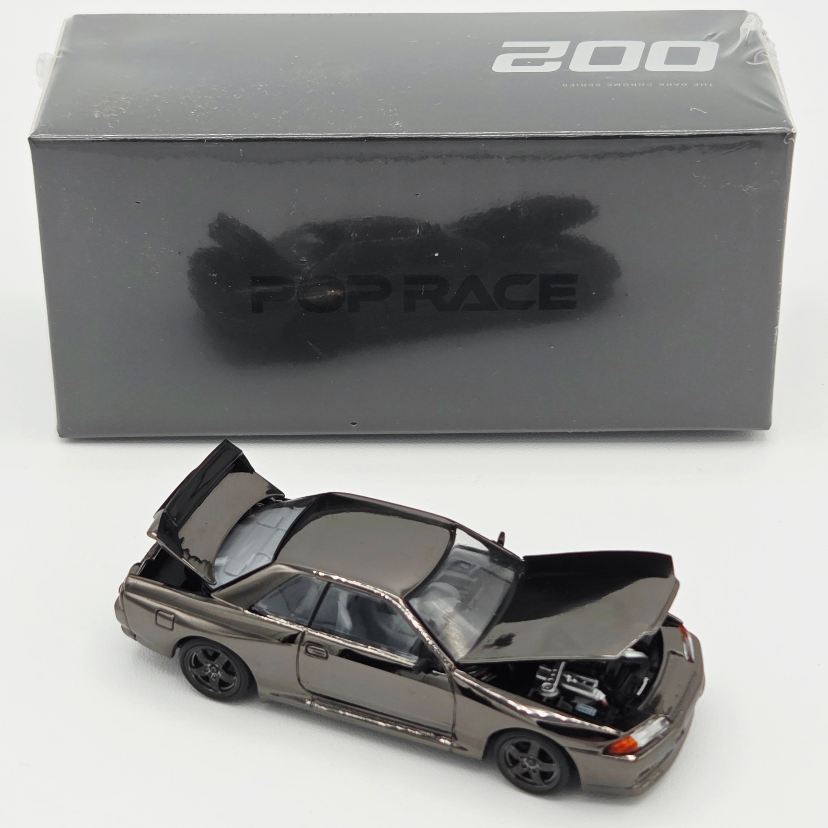 Pop Race Nissan Skyline GT-R R32 - 1:64, Black Chrome (2026 Limited Edition)