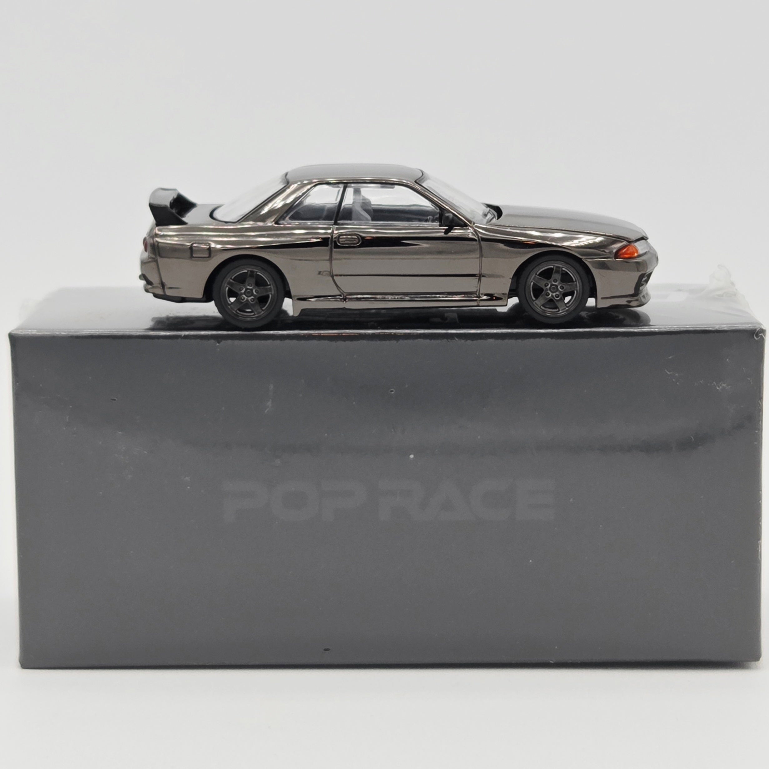 Pop Race Nissan Skyline GT-R R32 - 1:64, Black Chrome (2026 Limited Edition)